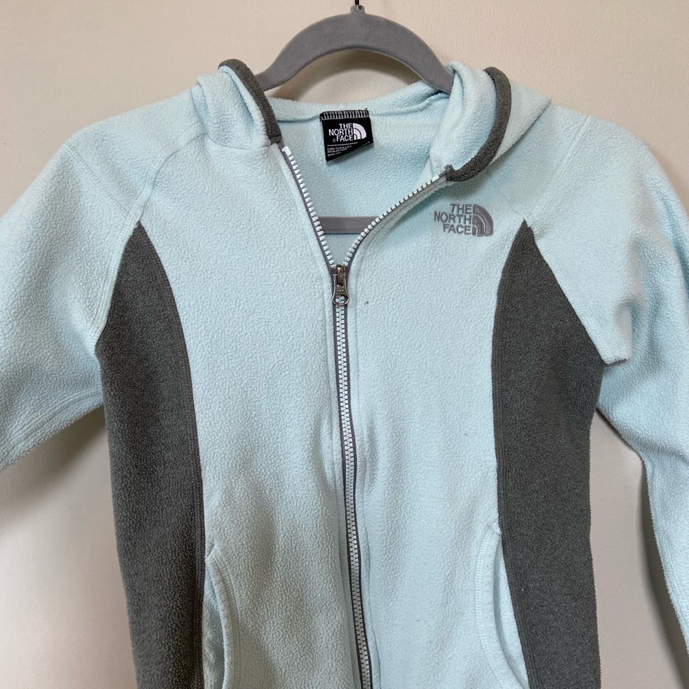 Blue and grey North Face zip up hoodie